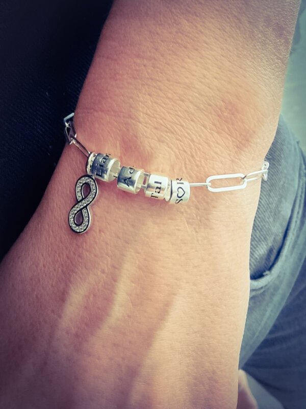 Bracelet with an Infinity Pendant and Charms